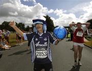 14 July 2007; Brian Tyrrell, from Popintree, Dublin, who traditionally wins the 'fancy dress' section, is all decked out in the Dublin colours after finishing the adidas Irish Runner Challenge. Pheonix Park, Dublin. Picture credit: Ray McManus / SPORTSFILE