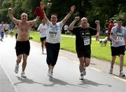 14 July 2007; David Curtis, left, Finglas, Co. Dublin, Anthony Keogh, Clonee, Co. Meath, and Austin Tuohy, right, Bray, Co. Wicklow, who ran to raise funds for 'NEW START' a rehabilitation programme for the homeless in Cabra Dublin, celebrate after completing the adidas Irish Runner Challenge. Pheonix Park, Dublin. Picture credit : Tomas Greally / SPORTSFILE