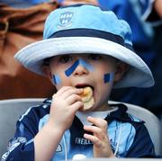 15 July 2007; Dublin supporter Scott McConnell, age 3 1/2, from Saggart, Co. Dublin, has a bite to eat during the game. Bank of Ireland Leinster Senior Football Championship Final, Dublin v Laois, Croke Park, Dublin. Picture credit: Brendan Moran / SPORTSFILE