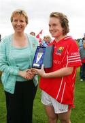 15 July 2007; Uachtaran Cumann Peil Gael na mBan Geraldine Giles presents the player of the match award to Cork's Sile Johnson. TG4 Ladies All-Ireland Minor Football Final, Dublin v Cork, JJ Brackens GAA Club, Templemore, Co. Tipperary. Picture credit: Kieran Clancy / SPORTSFILE