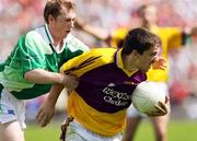 8 July 2007; Ciaran Lyng, Wexford, in action against Thomas McElroy, Fermanagh. Bank of Ireland All-Ireland Senior Football Championship Qualifier, Round 1, Fermanagh v  Wexford, St Tighearnach's Park, Clones, Co. Monaghan. Picture credit: Oliver McVeigh / SPORTSFILE