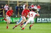 21 July 2007; Kevin McMahon, Cork, in action against John O'Brien, Louth. Bank of Ireland All-Ireland Senior Football Championship Qualifier, Round 3, Louth v Cork, O'Moore Park, Portlaoise, Co. Laois. Picture credit: Ray McManus / SPORTSFILE