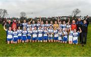 29 November 2014; Castleisland Desmonds squad and management team celebrate with the cup after victory over Clonbur. TESCO HomeGrown Intermediate Ladies Football Club Championship Final, Castleisland Desmonds, Kerry v Clonbur, Galway. Corofin, Co. Clare. Picture credit: Diarmuid Greene / SPORTSFILE