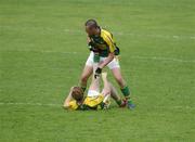1 July 2007; Kerry's Kieran Donaghy assists team-mate Colm Cooper during the game. Bank of Ireland Munster Senior Football Championship Final, Kerry v Cork, Fitzgerald Stadium, Killarney, Co. Kerry. Picture credit: Ray McManus / SPORTSFILE