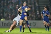 29 November 2014; Darragh Fanning, Leinster, beats the tackle of Cai Griffiths, left, and Sam Davies, Ospreys. Guinness PRO12, Round 9, Leinster v Ospreys, RDS, Ballsbridge, Dublin. Picture credit: Ramsey Cardy / SPORTSFILE