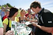 31 July 2007; Ireland's Brian O'Driscoll signs autographs for fans Rosalyn Prior, Cratloe, Co. Clare, and Mairead Sheedy, Kilfinane, Co. Limerick, after squad training. Ireland Rugby Squad Training, University of Limerick, Limerick. Picture credit: Kieran Clancy / SPORTSFILE