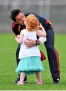 13 July 2014; Carlow manager Anthony Rainbow gets a kiss from his daughter Robin, aged three years, after the game. GAA Football All-Ireland Senior Championship Round 2B, Carlow v Clare, Dr Cullen Park, Carlow. Picture credit: Dáire Brennan / SPORTSFILE