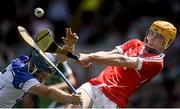 13 July 2014; The Limerick goalkeeper Eoghan McNamara clears under pressure from Waterford corner forward Patrick Curran. Electric Ireland Munster GAA Hurling Minor Championship Final, Limerick v Waterford, Pairc Uí Chaoimh, Cork. Picture credit: Ray McManus / SPORTSFILE