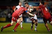 6 December 2014; Louis Ludik, Ulster, is tackled by Jake Ball, left, and Rory Pitman, Scarlets. European Rugby Champions Cup 2014/15, Pool 3, Round 3, Ulster v Scarlets, Kingspan Stadium, Ravenhill Park, Belfast, Co. Antrim. Picture credit: Oliver McVeigh / SPORTSFILE