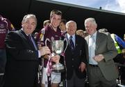 8 July 2007; Galway captain Paul Conroy is presented with the cup by, from left, Nickey Brennan, President of the GAA, Dr. Mick Loftus, former GAA President, and Michael Joyce, ESB. ESB Connacht Minor Football Championship Final, Roscommon v Galway, Dr. Hyde Park, Roscommon. Picture credit: Ray McManus / SPORTSFILE