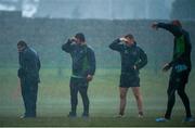 9 December 2014; Connacht backs and kicking coach Andre Bell, left, and players Saba Meunargia, Shane O'Leary, and Darragh Leader shield their eyes from heavy rainfall during during squad training ahead of their European Rugby Challenge Cup match against Bayonne on Saturday. Connacht Rugby Squad Training, The Sportsground, Galway. Picture credit: Diarmuid Greene / SPORTSFILE