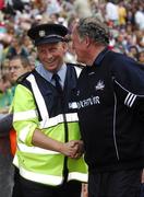 4 August 2007; The Dublin manager Paul Caffrey, on duty as a Garda, in conversation with Cork doctor Con Murphy. Bank of Ireland Football Championship Quarter Final, Sligo v Cork, Croke Park, Dublin. Picture Credit; Ray McManus / SPORTSFILE