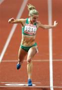 10 August 2007; Ailis McSweeney, from Carrigtwohill, Co. Cork, representing DCU and Ireland, crosses the finish to qualifying for the Semi-Finals of the Women's 100m, with a season's best time of 11.92 sec. World University Games 2007, Women's 100m, Round 2, Main Stadium, Thammasat University, Bangkok, Thailand. Picture credit: Brian Lawless / SPORTSFILE