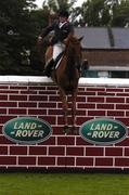 11 August 2007; Robert Whitaker, Great Britian, on Finbarr, clears the wall on their way to winning the 2007 Land Rover Puissance. Failte Ireland Dublin Horse Show, RDS Main Arena, RDS, Dublin. Picture credit; Stephen McCarthy / SPORTSFILE *** Local Caption ***