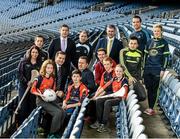 18 December 2014; The GPA Madden Leadership Programme will develop a group of county players from hurling, football and camogie with the necessary skills, motivation and experience to become successful leaders in the community. The Programme, which will run initially for three years, is a bespoke, one-year blended learning Leadership Course which will be delivered by the Gaelic Players Association in conjunction with independent leadership experts. Pictured at the launch of GPA Madden Leadership Programme are, from left, Wexford camogie star Ursula Jacob, Mayo footballer Cillian O'Connor, Dessie Farrell, Chief Executive of the Gaelic Players Association, Tipperary hurler Darren Gleeson, Armagh footballer Ciaran McKeever, Michael Madden, Limerick hurler Seamus Hickey, former Tipperary hurling manager Liam Sheedy, Kerry footballer Paul Murphy, Dublin footballer Ger Brennan and Mayo football star Fiona McHale with Scoil Neasáin Harmonstown pupils, from left, Rachel Nic Aonghusa, age 12, Niall O Cairbre, age 11, Cúán O Maoileoin, age 12, and Ellen Potts, age 11. Croke Park, Dublin. Picture credit: Ramsey Cardy / SPORTSFILE