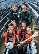18 December 2014; The GPA Madden Leadership Programme will develop a group of county players from hurling, football and camogie with the necessary skills, motivation and experience to become successful leaders in the community. The Programme, which will run initially for three years, is a bespoke, one-year blended learning Leadership Course which will be delivered by the Gaelic Players Association in conjunction with independent leadership experts. Pictured at the launch of GPA Madden Leadership Programme are Armagh footballer Ciaran McKeever, left, and Limerick hurler Seamus Hickey with Scoil Neasáin Harmonstown pupils, from left, Niall O Cairbre, age 11,  Rachel Nic Aonghusa, age 12, Cúán O Maoileoin, age 12, and Ellen Potts, age 11. Croke Park, Dublin. Picture credit: Ramsey Cardy / SPORTSFILE