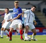 19 August 2006; Steven Douglas, Linfield, in action against Francis Murphy, Lisburn Distillery. CIS Insurance Cup, Linfield v Lisburn Distillery, Windsor Park, Belfast, Co. Antrim. Picture credit: Oliver Mc Veigh / SPORTSFILE