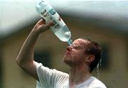9 April 1999; Damien Duff cools himself down during a water break at a Republic of Ireland U20 Squad training sesssion at the Liberty Stadium in Ibadan, Nigeria. Photo by David Maher/Sportsfile