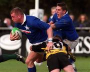 26 February 2000; Victor Costello of St Mary's is tackled by Eamon Buckley of Young Munster during the AIB League Division 1 match between St Mary's and Young Munster at Templeville Road in Dublin. Photo by Matt Browne/Sportsfile