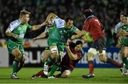 1 January 2015; George Naoupu, Connacht, is tackled by CJ Stander, Munster. Connacht v Munster, Guinness PRO12 Round 12. Sportsground, Galway. Picture credit: Ramsey Cardy / SPORTSFILE