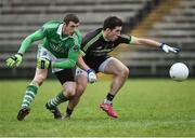 4 January 2015; Fermanagh's Eamon McHugh in action against Ronan McGrady, QUB. Bank of Ireland Dr McKenna Cup Round 1, Fermanagh v QUB. Brewster Park, Enniskillen Co. Fermanagh. Picture credit: Philip Fitzpatrick/ SPORTSFILE