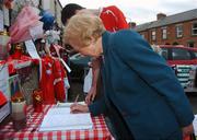 1 September 2007; Carmel Byrne signs the book of condolences to honour her brother the late Oliver (Ollie) Byrne, Chief Executive and majority shareholder of Shelbourne Football Club, outside the club's homeground. Tolka Park, Dublin. Picture credit; Stephen McCarthy / SPORTSFILE