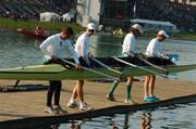 2 September 2007; Members of the men's Lightweight team, left to right, Paul Griffin, stroke, Richard Archibald, third seat, Eugene Coakley, second seat and Cathal Moynihan, bow, lower their boat into the water, before the Lightweight men's four's B Final at the 2007 World Rowing Championships, Oberschleissheim, Munich, Germany. Picture credit: David Maher / SPORTSFILE