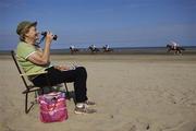 6 August 2007; Margaret Prendergast, from Laytown, watches on as the runners and riders go to post for the start of the Castlemartin Park Claiming Race. Laytown Races, Laytown, Co. Meath. Picture credit: Brian Lawless / SPORTSFILE