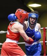 9 January 2015; Moira McElligot, Rathkeale, left, exchanges punches with Cheyanne O’Neill, Athlone, during their 57kg bout. National Elite Boxing Championships, National Stadium, Dublin. Picture credit: Ramsey Cardy / SPORTSFILE