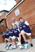 4 September 2007; Soccer legend Johnny Giles with children from Hardwick Street Flats at a photo-call to promote the Kellogg's Inner City Futsal programme which is run by the Football Association of Ireland, and supported by Dublin City Council, Dun Laoghaire-Rathdown, South Dublin and Fingal County Councils, left to right, Patrick Burke, aged 8, Adam Kavanagh, aged 9, Megan Dwyer, aged 8, Lauren Maher, aged 8 and James Kavanagh, aged 11.This year, almost 1,500 Dublin children took part in the Kellogg's Inner City Futsal programme at 60 centres throughout the city, where they were put through their paces by a team of FAI Development Officers. Buckingham Street, Dublin. Photo by Sportsfile