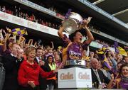 9 September 2007; Wexford captain Mary Leacy lifts the O'Duffy Cup while Gary Desmond, CEO, Gala Retail Services, and Liz Howard, President of the Camogie Association, look on. Gala All-Ireland Senior Camogie Final, Cork v Wexford, Croke Park, Dublin. Picture credit; Pat Murphy / SPORTSFILE