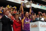 9 September 2007; Wexford captain Mary Leacy lifts the O'Duffy Cup while Gary Desmond, CEO, Gala Retail Services, and Liz Howard, President of the Camogie Association, look on. Gala All-Ireland Senior Camogie Final, Cork v Wexford, Croke Park, Dublin. Picture credit; Pat Murphy / SPORTSFILE