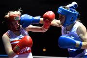 16 January 2015; Kristina O'Hara, left, Emerald Boxing Club, exchanges punches with Elaine Harrison, Ballina, Co. Mayo, during their 51kg bout. National Elite Boxing Championships, Semi-Finals, National Stadium, Dublin. Picture credit: David Maher / SPORTSFILE