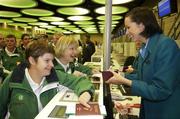 27 September 2007; On their way! Members of the Golf team Ruth O'Mahoney, from Blackrock, Co. Cork, left, and Rosaleen Moore, from Pouladuff, Co. Cork, are checked in by Aer Lingus member of staff Mary Kate McGovern at Dublin Airport prior to boarding Aer Lingus sponsored flight to London Heathrow en route to the Special Olympics World Summer Games. The 2007 Special Olympics World Summer Games will take place in Shanghai from the 2nd October to the 11th October 2007. Ireland will be represented by a team of 143 athletes and 55 coaches who will participate in 11 sports. Dublin Airport, Dublin. Picture credit: Brian Lawless / SPORTSFILE