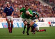 19 March 2000; Brian O'Driscoll of Ireland breaks through the defence on the way to scoring his third try during the Six Nations Rugby Championship match between France and Ireland at the Stade de France in Paris, France. Photo by Ray Lohan/Sportsfile