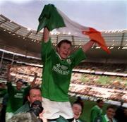 19 March 2000; Brian O'Driscoll of Ireland celebrates after the final whistle after the Six Nations Rugby Championship match between France and Ireland at the Stade de France in Paris, France. Photo by Ray Lohan/Sportsfile *** Local Caption ***