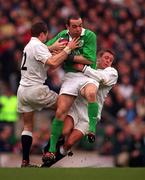 5 February 2000; Conor O'Shea of Ireland  is tackled by Mike Catt and Jonny Wilkinson, right, of England during the Lloyds TSB 6 Nations match between England and Ireland at Twickenham Stadium in London, England. Photo by Brendan Moran/Sportsfile