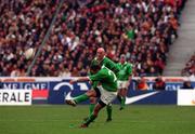 19 March 2000; David Humphreys of Ireland, watched by his captain Keith Wood, kicks the winning penalty during the Six Nations Rugby Championship match between France and Ireland at the Stade de France in Paris, France. Photo by Ray Lohan/Sportsfile *** Local Caption ***