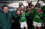 19 March 2000; Ireland players and team manager Donal Lenihan celebrate after the Six Nations Rugby Championship match between France and Ireland at the Stade de France in Paris, France. Photo by Ray Lohan/Sportsfile *** Local Caption ***