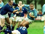 24 April 1999; Dominic Crotty of Garryowen in action against Kevin Nowlan, 15, and Trevor Brennan of St Mary's College  during the AIB All-Ireland League match between Garryowen and St Mary's College at Dooradoyle in Limerick. Photo by Brendan Moran/Sportsfile