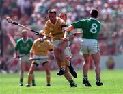 4 August 1996; Gary O'Kane of Antrim in action against Ger Hegarty of Limerick during the Guinness All-Ireland Senior Hurling Championship Semi-Final match between Antrim and Limerick at Croke Park in Dublin. Photo by Ray McManus/Sportsfile