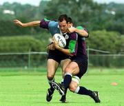 15 June 1999; Girvan Dempsey is tackled by Ross Nesdale during Ireland Rugby squad training at the Palmarya Rugby Club in Western Australia. Photo by Matt Browne/Sportsfile