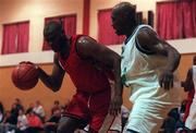 7 November 1999. Randall Mounts of Tolka Rovers in action against Roscoe Patterson of Waterford Crystal during the ESB Men's Superleague Basketball match between Tolka Rovers and Waterford Crystal at Griffith Avenue in Dublin. Photo by Brendan Moran/Sportsfile