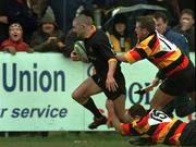 17 April 1999; Robert Lee of Buccaneers on his way to scoring a try as he is tackled by Marcus Dillon and Rory Kearns, 15, of Lansdowne during the AIB All-Ireland League Division 1 match between Buccaneers RFC and Lansdowne RFC at Moher Road in Ballinasloe, Galway. Photo by Matt Browne/Sportsfile
