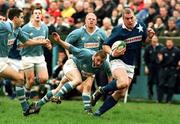 24 April 1999. Victor Costello of St Mary's in action against Pat Humphreys, centre, and Jeremy Staunton of Garryowen during the AIB All-Ireland League match between Garryowen and St Mary's College at Dooradoyle in Limerick. Photo by Brendan Moran/Sportsfile