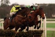 6 February 2000; Youlneverwalkalone, farside, with Conor O'Dwyer up clears the last ahead of Sackville with Barry Geraghty up on the way to winning the Deloitte and Touche during the Novice Hurdle at Leopardstown Racecourse in Dublin. Photo by Matt Browne/Sportsfile