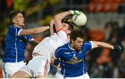 24 January 2015; Padraig McNulty, Tyrone, in action against Killian Clarke and Damien O'Reilly, Cavan. McKenna Cup Final, Tyrone v Cavan, Athletic Grounds, Armagh. Picture credit: Oliver McVeigh / SPORTSFILE