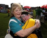 4 October 2007; Irish goalkeeper Edel Hannon, from Dramore, Co. Sligo, is embraced by her mother Catherine after the game. China v Ireland, 2007 Special Olympics World Summer Games, Shanghai Yangguang Soccer Field, Shanghai, China. Picture credit: Ray McManus / SPORTSFILE