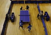 5 October 2007; Team Ireland table tennis player Pat Dorgan, top left, Redemption Road, Co. Cork, serves under the watchful eyes of his playing partner Fergal Bolger, from Graignamanagh, Co. Kilkenny, while watched by their Chinese opponents and the two match officials during a first round doubles game. 2007 Special Olympics World Summer Games, Shanghai Minhang Gymnastics Centre, Shanghai, China. Picture credit: Ray McManus / SPORTSFILE