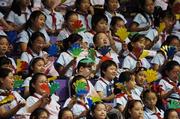 7 October 2007; Children from the nearby Shanghai Number 3 Girls School cheer on the competitors in the gymnastics events. 2007 Special Olympics World Summer Games, Shanghai International Gymnastics Centre, Shanghai, China. Picture credit: Ray McManus / SPORTSFILE